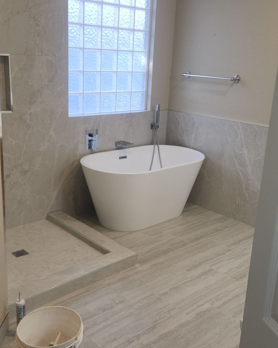 Freestanding soaking tub in a remodeled primary bath